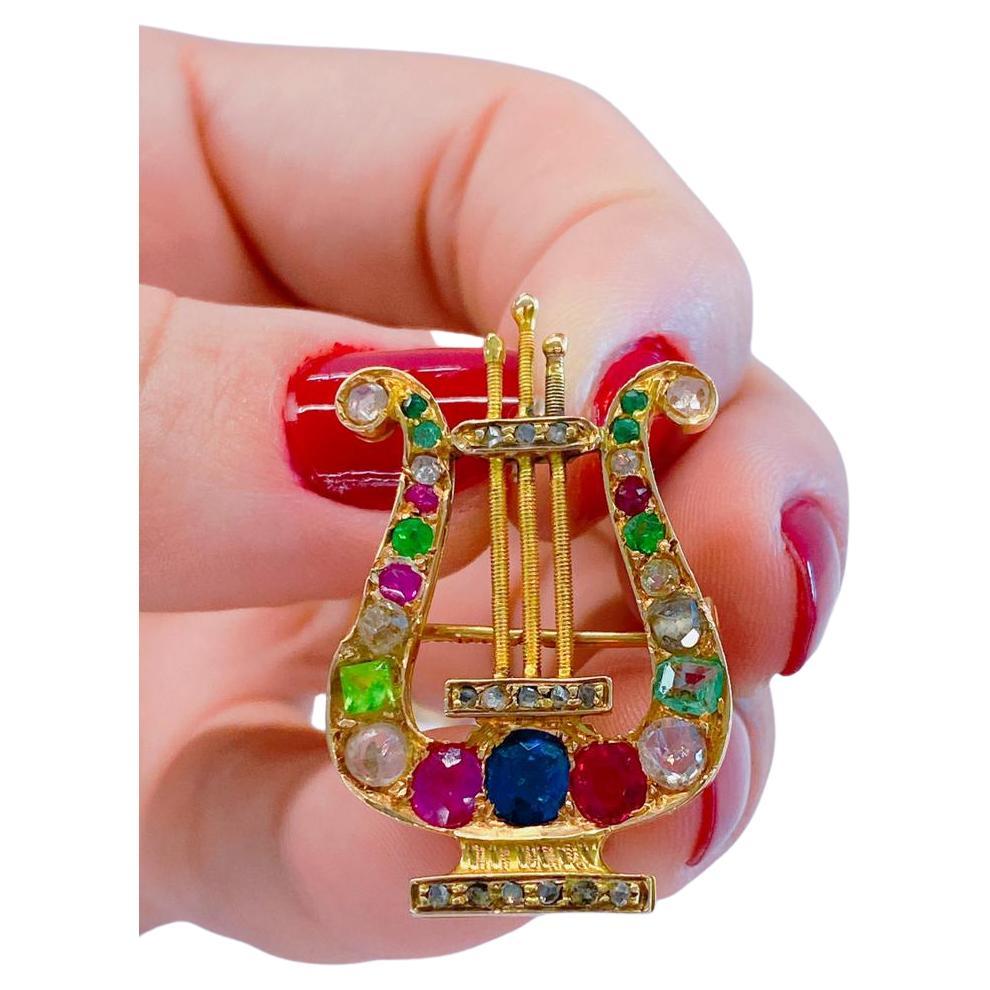 Antique Russian brooch pendant with multi gem color stones and diamonds consists of natural ruby /demantoid sapphire/ emerald/old mine cut diamond/ rose cut diamonds in 14k gold setting with total length of 3.5cm hall marked 56 imperial Russian gold
