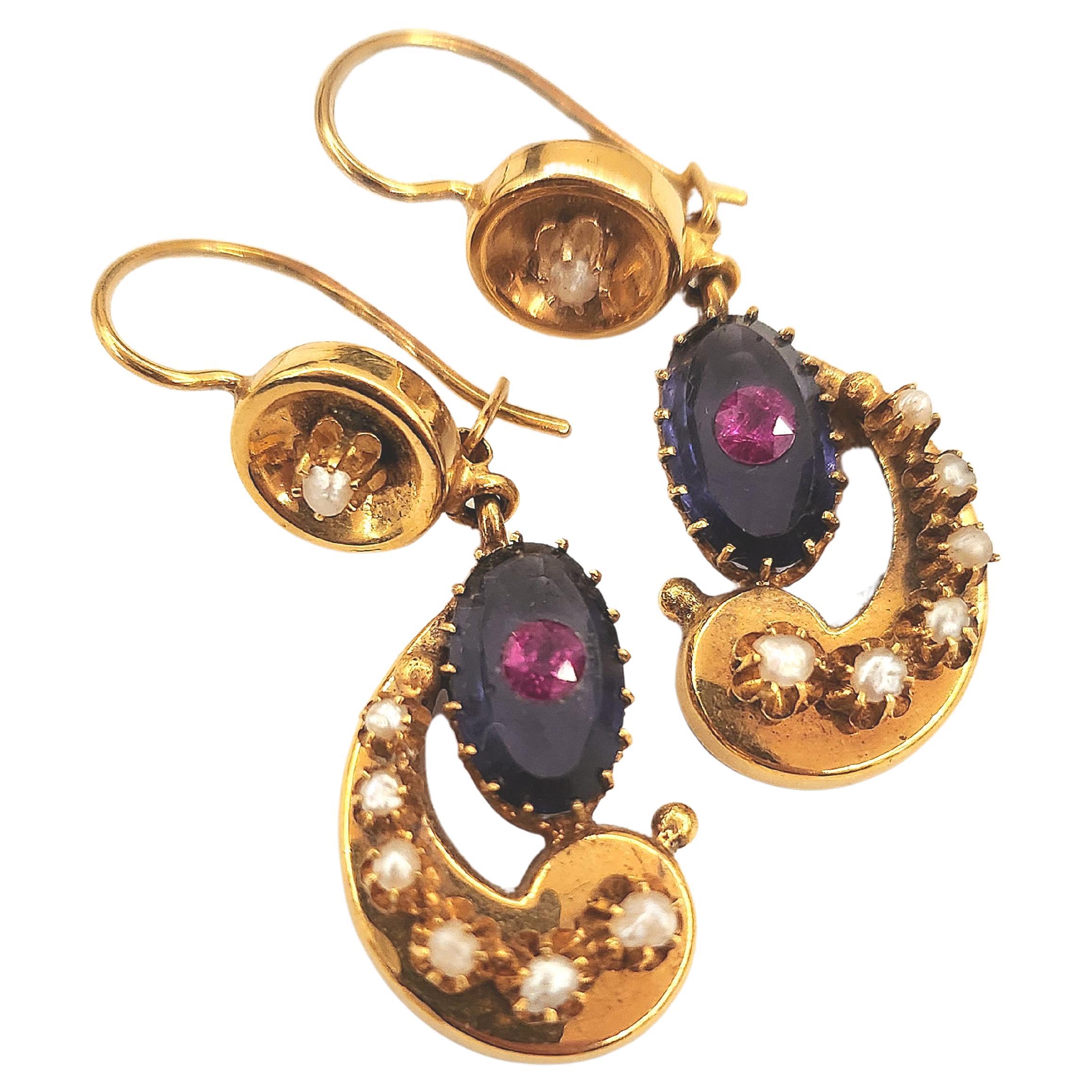 Antique 14k gold earrings with oval pink amethyst centeted with red rubie stone flanked with white seed pearls with total earrings lenght 4.5cm earrings was made in the caucasus region during the imperial russian era 1907/1910.c russian tsarist era