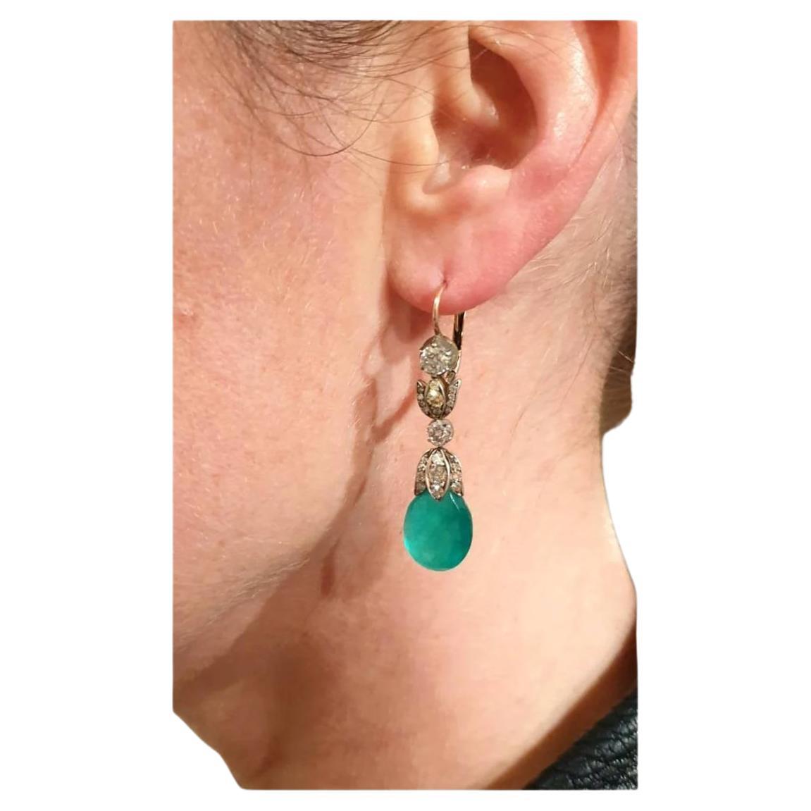 Antique 14k gold earrings with 2 dangling green emerald in pear shape with an estimate emerald weight of 5 carats and old cut diamond weight of 2.5 carats H color vs clearity total earrings length 4.5cm hall marked 56 imperial Russian gold standard