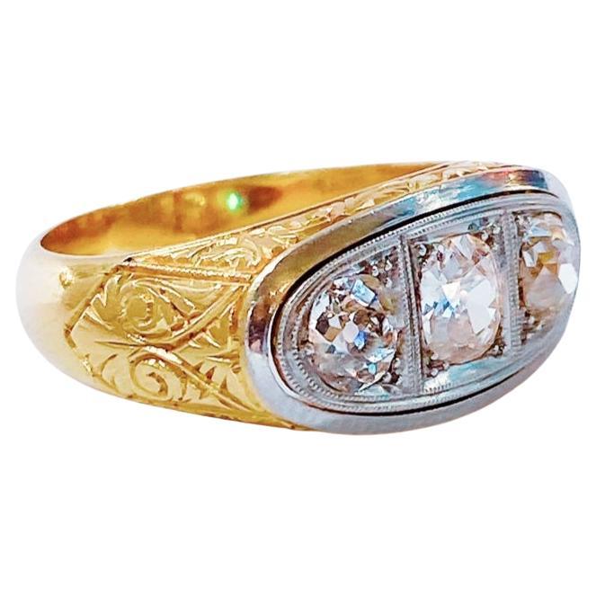 Art deco 18k yello gold ring with engraved detailed work centered with 3 large diamonds topped with white gold with estimate diamond weight of 1.70 carats H colour white vs clearity excellent cut and spart and total gold weight of 10 grams 
