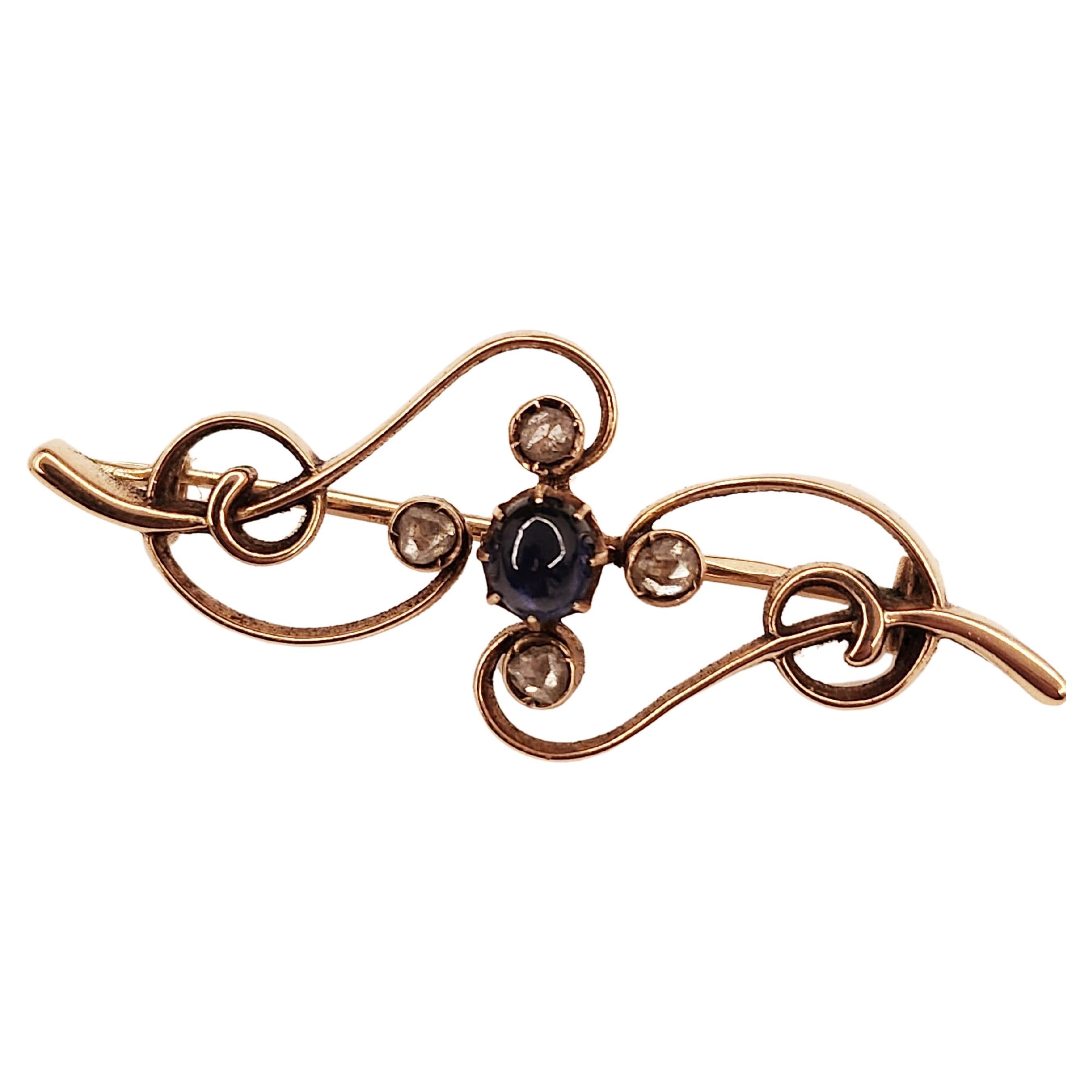 Antique russian 14k gold brooch centered with blue sapphire cobouchon cut stone flanked with 4 rose cut diamonds with lenght of 4cm brooch was made in moscow 1899.c during the imperial russian era hall marked on pin with old marks in cyrllic