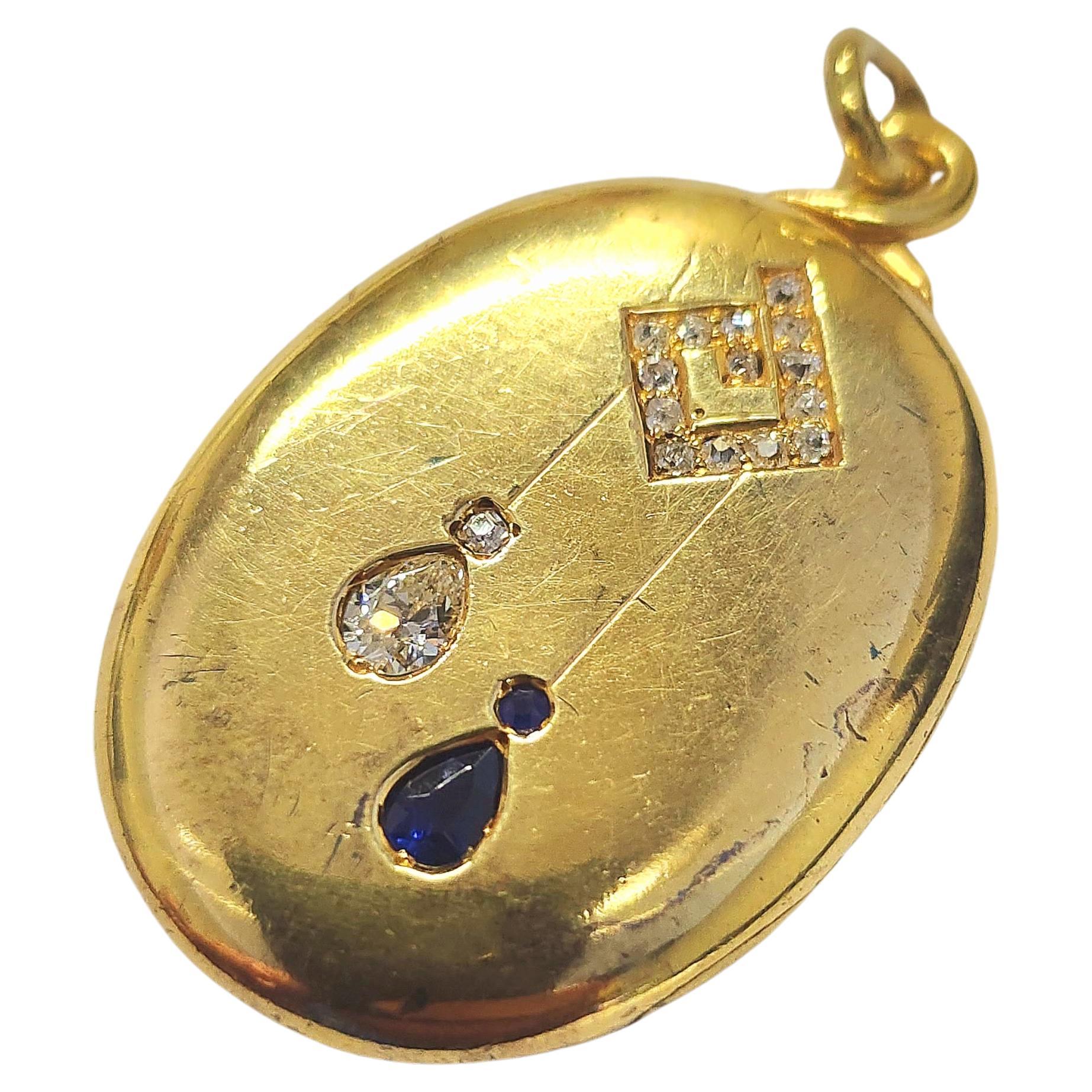 Antique 14k gold russian locket pendant centered with a pear shape old cut diamond and navy blue natural sapphire pendant dates back to the russian imperial era 1880/1899.c hall marked 56 imperial russian gold standard with a total gold weight of 13