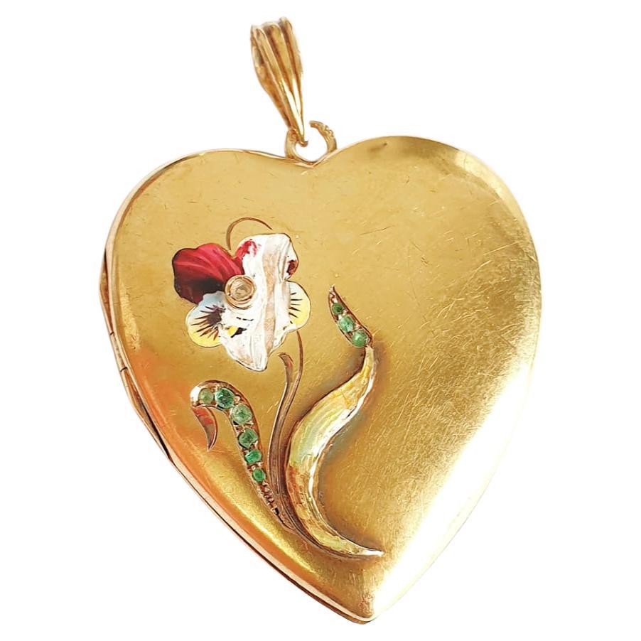 Antique 14k gold russian locket pendant in shape of heart with colorful enamel drawing of a flower decortated with green demantoid and diamond pendant was made during the imperial russian era 1899.c hall marked 56 imperial russian gold standard and