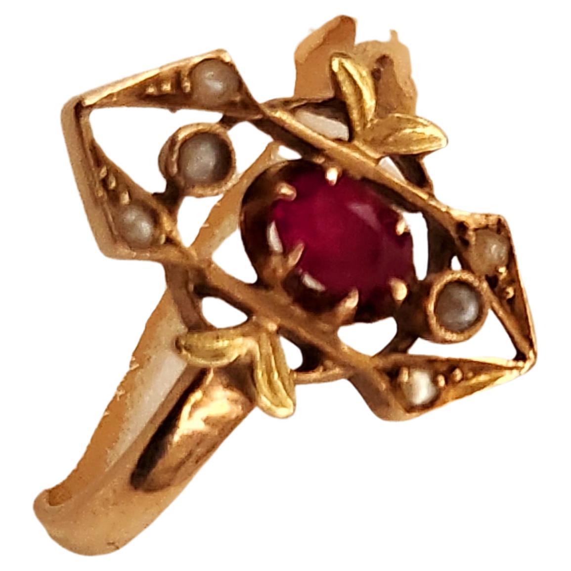 Antique 14k gold ring on gemotratic designe centeted with 1 natural oval cut ruby stone flanked with old seed pearls ring was made in moscow during the imperial russian era 1907/1917.c hall marked 56 imperial russian gold standard and moscow assay