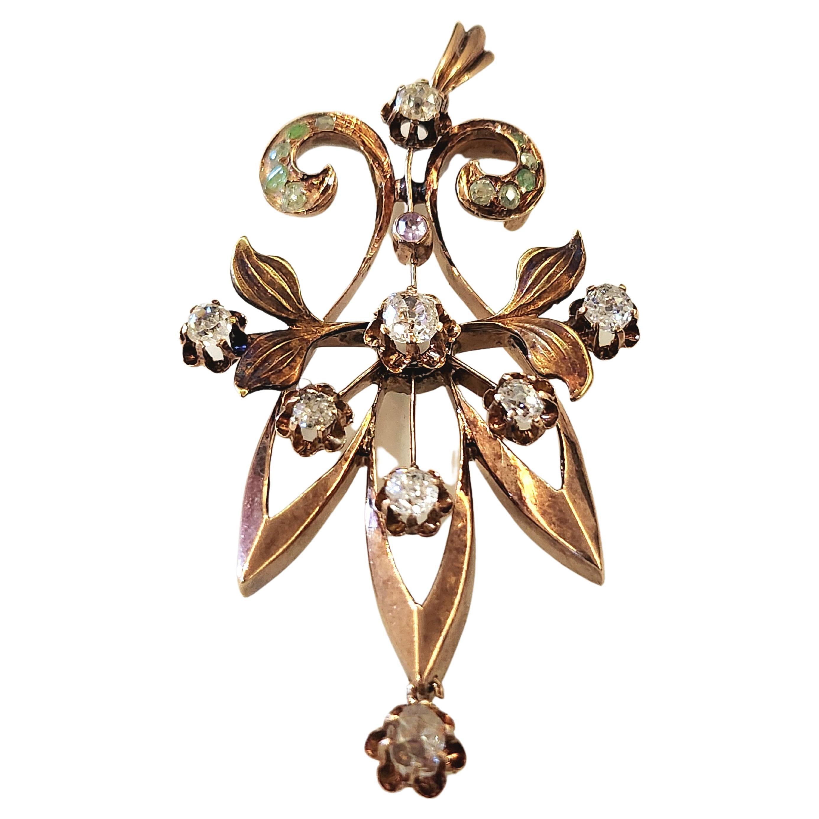 Antique 14k gold russian pendant in art novo style with old mind cut diamonds estimate weight of 1 carat decorted with natural green demantoid stones pendant was made in moscow during the imperial russian era 1907/1910.c hall marked 56 imperial