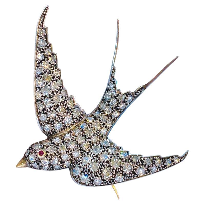 Antique victorian large swallow bird brooch with an estimate old mine cut diamond weight of 3 carats H colour white excellent cut and spark decorted with rubies eyes brooch messures 4.5cm×4.5cm hall marked with 3 victorian marks dates back to