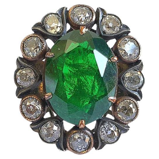 14k gold ring centered with a large beutiful dark green chrome diopside stone flanked with old mine cut diamonds with estimate weight of 1.5 carats H color white hall marked 56 imperial russian gold standard 