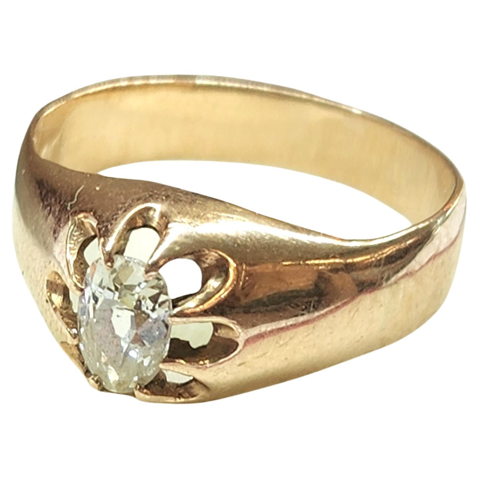 Antique 14k yellow gold solitaire ring unisex in style centered with pear shape old mine cut diamond white color vs clearity estimate weight 70 carats in open prongs ring dates back to 1900/1910.c