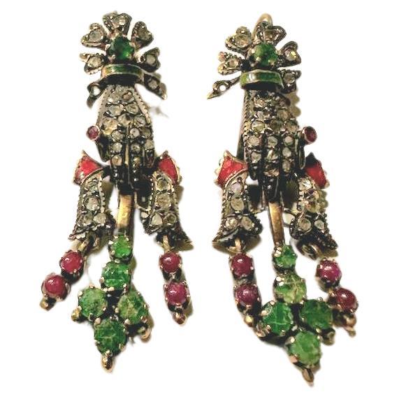 Victorian era large earrings 1880s in hand designe holding gem stones natural green emeralds rubies and rose cut diamonds decorted with red and green enamel in 10k gold setting with a total estimate weight gem stones 4 carats 