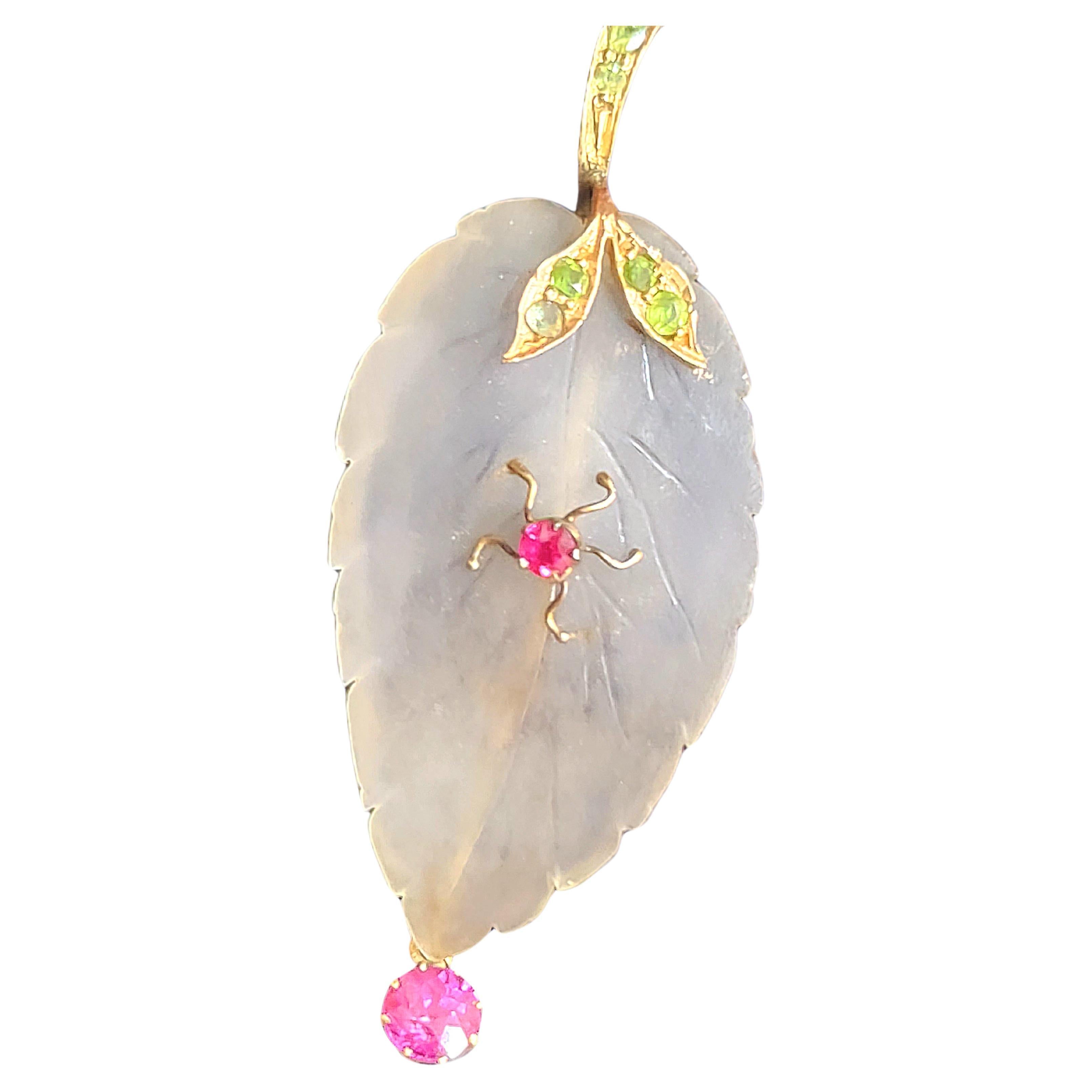 Antique imperial russian era 1910s rock crystal brooch tooped with 14k gold demantoid pail decorted with a dangling pink tourmaline brooch lenght 7cm hall marked 56 imperial gold standard and assay mark 
