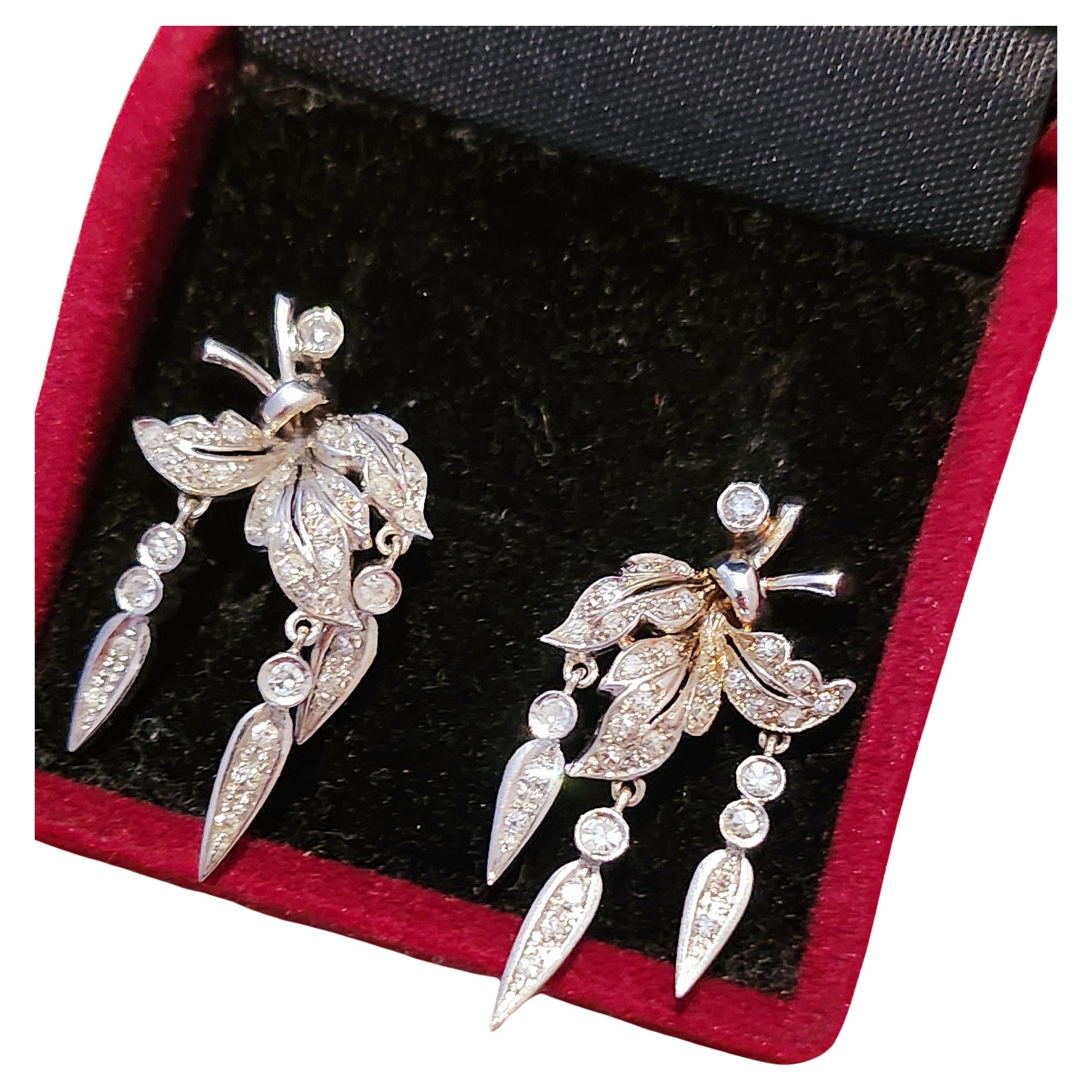 Vintage 18k white gold earrings in leaf designe with estimate diamond weight 0.70ct and 7.50 grams of gold earrings made in argantina hall marked with gold finest