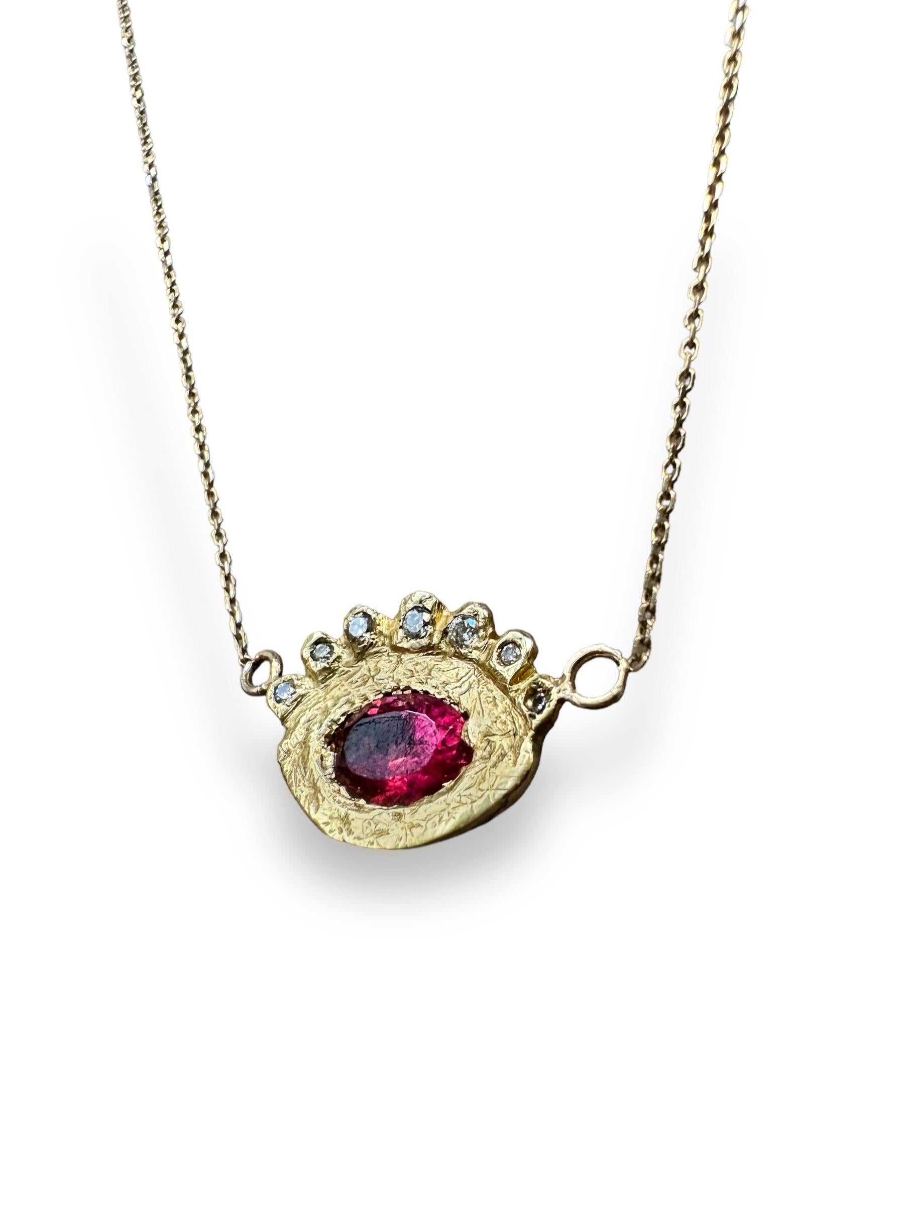 Introducing our elegant and captivating one of a kind Hera 18k yellow gold rubellite eye pendant.

The main protagonist is a beautiful rubellite tourmaline, known for its vibrant and alluring deep reddish-pink hue. Its unique color, combined with