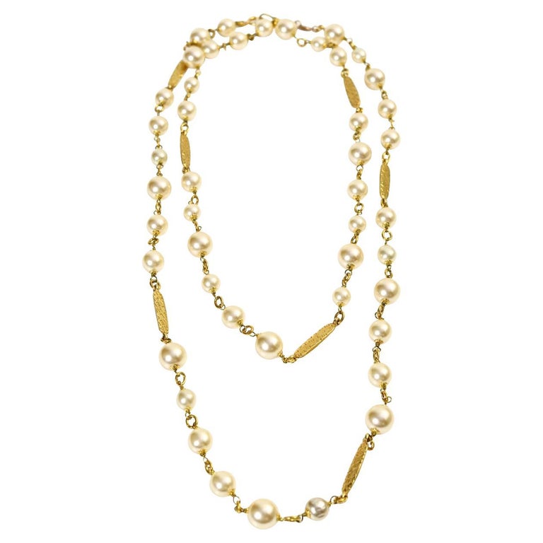 Vintage Chanel Long Pearl Necklace Sautoir with Bars Of Gold Chanel Chanel/Chanel in Between. Circa 1983.  Can be twisted two or three times around as per your preference.  This necklace is a classic necklace that could be listed amoung the top