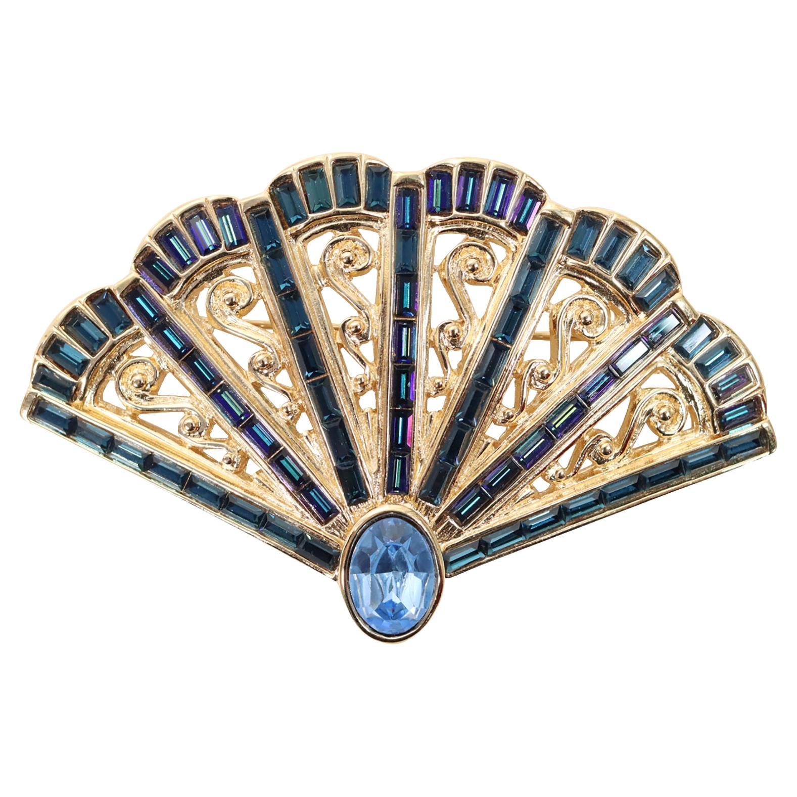 Vintage YSL Gold Tone with Blue Sapphire Crystals Fan Brooch Circa 1990s For Sale
