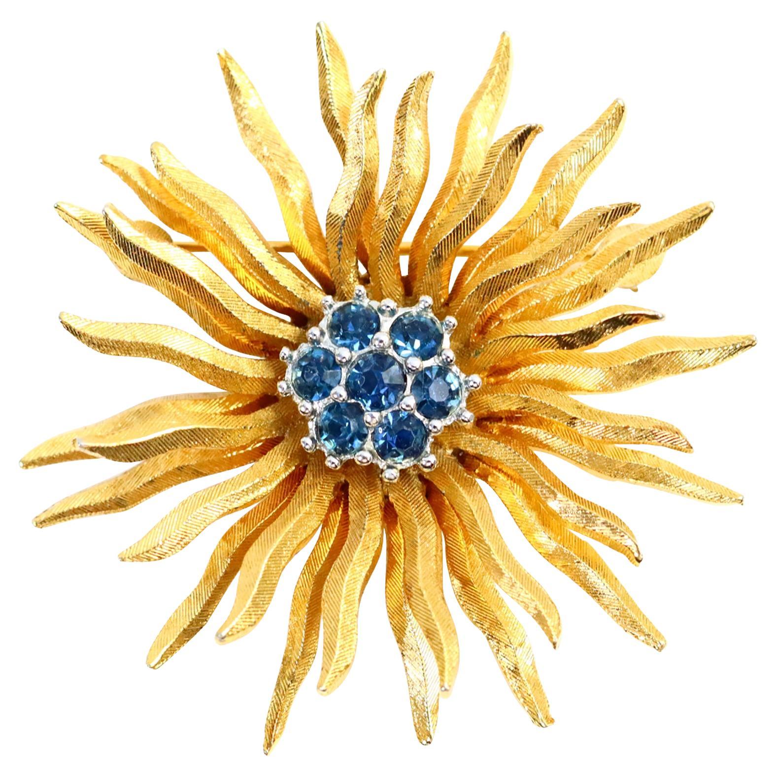 Vintage D
orlan Gold Starburst mit blauem Diamanten in Silber gefasst in Silber Circa 1980er Jahre