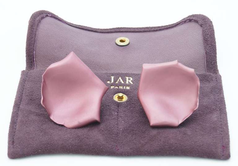 Featuring a pair of rose petal earrings by JAR (Joel Arthur Rosenthal). Each earring designed as a sculpted aluminum rose petal, mounted in 18k gold, with maker's marks Signed JAR. 

The earrings come with the original suede pouch.

JAR is often