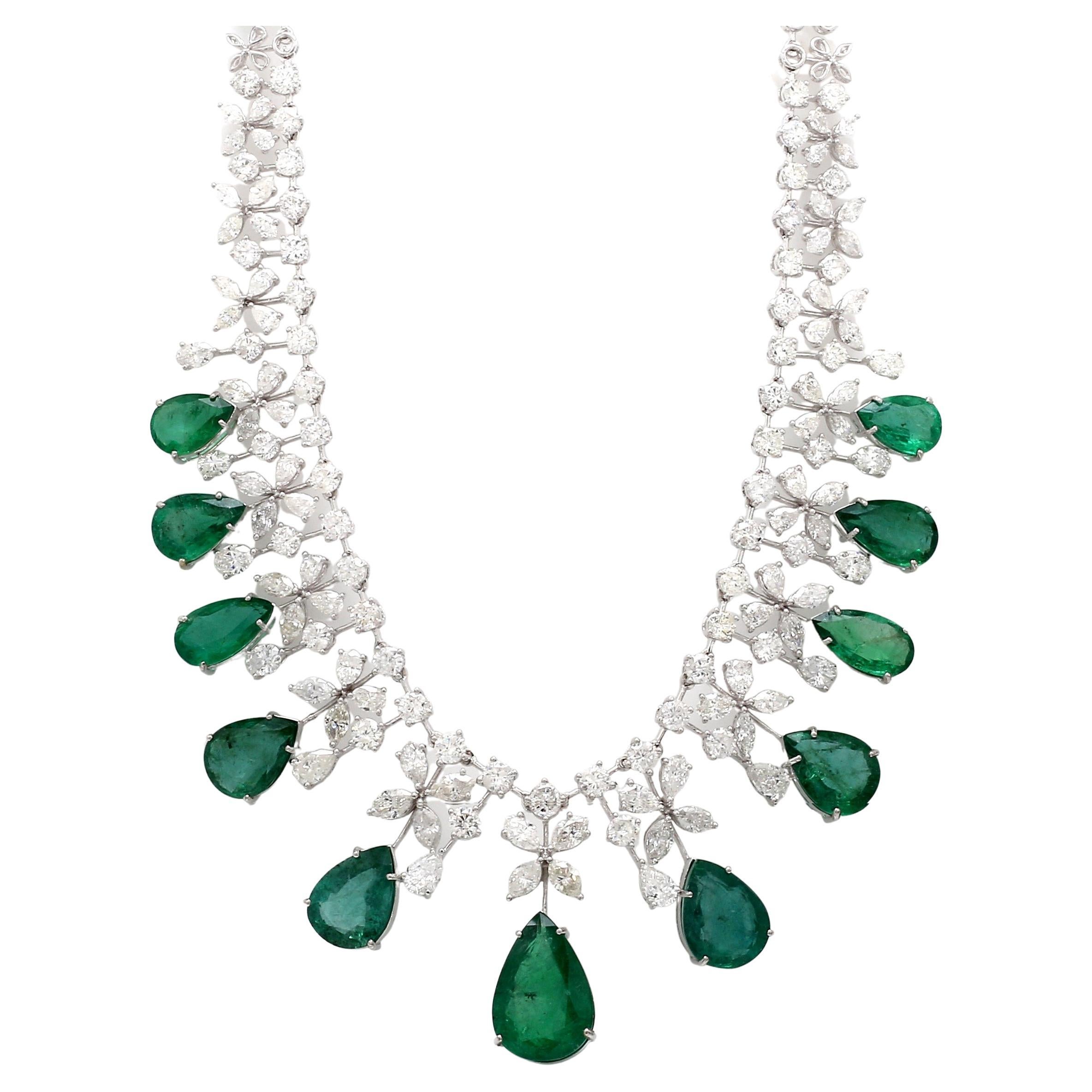 The necklace is meticulously crafted from 18 karat white gold, chosen for its luxurious appearance and durability. The white gold setting perfectly complements the emerald and diamonds, creating a harmonious fusion of elegance and strength. The