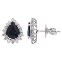 Clous d
oreilles en or blanc 14 carats avec saphir bleu poire et diamants