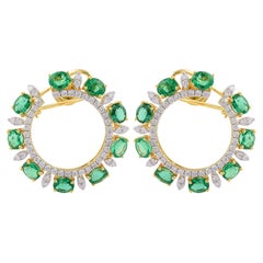 Boucles d
oreilles à levier en or jaune 14 carats avec émeraudes de Zambie ovales et diamants