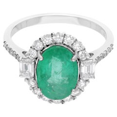 Anello con smeraldo dello Zambia di forma ovale, purezza SI, colore HI, diamante, oro bianco 14 kt.