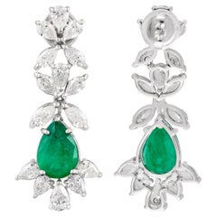 Boucles d
oreilles poire diamant en or blanc 14 carats avec émeraudes naturelles