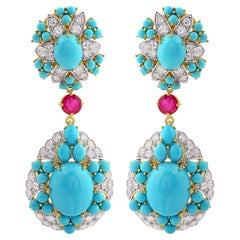 Pendants d
oreilles Arizona en or jaune 18 carats avec turquoises, rubis et diamants