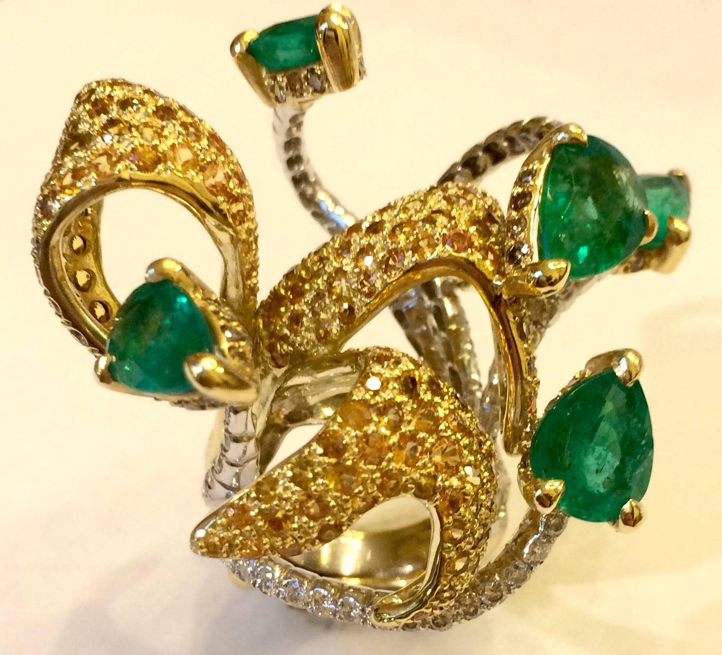 Emerald Sculpture Ring

A Gold, Emerald, White and Brown Diamonds and Yellow Sapphire handmade and unique creation by Andrea Ghelli. 

One of Andrea's favorite theme, Nature. 
Movement, dynamism and the fleeting impressions which characterize