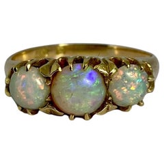 European ring made of 14 carat yellow gold with 3 stunning opals of 1.6 carat