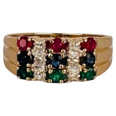 Anillo vintage de tres bandas de oro amarillo de 14K con rubíes, zafiros y esmeraldas