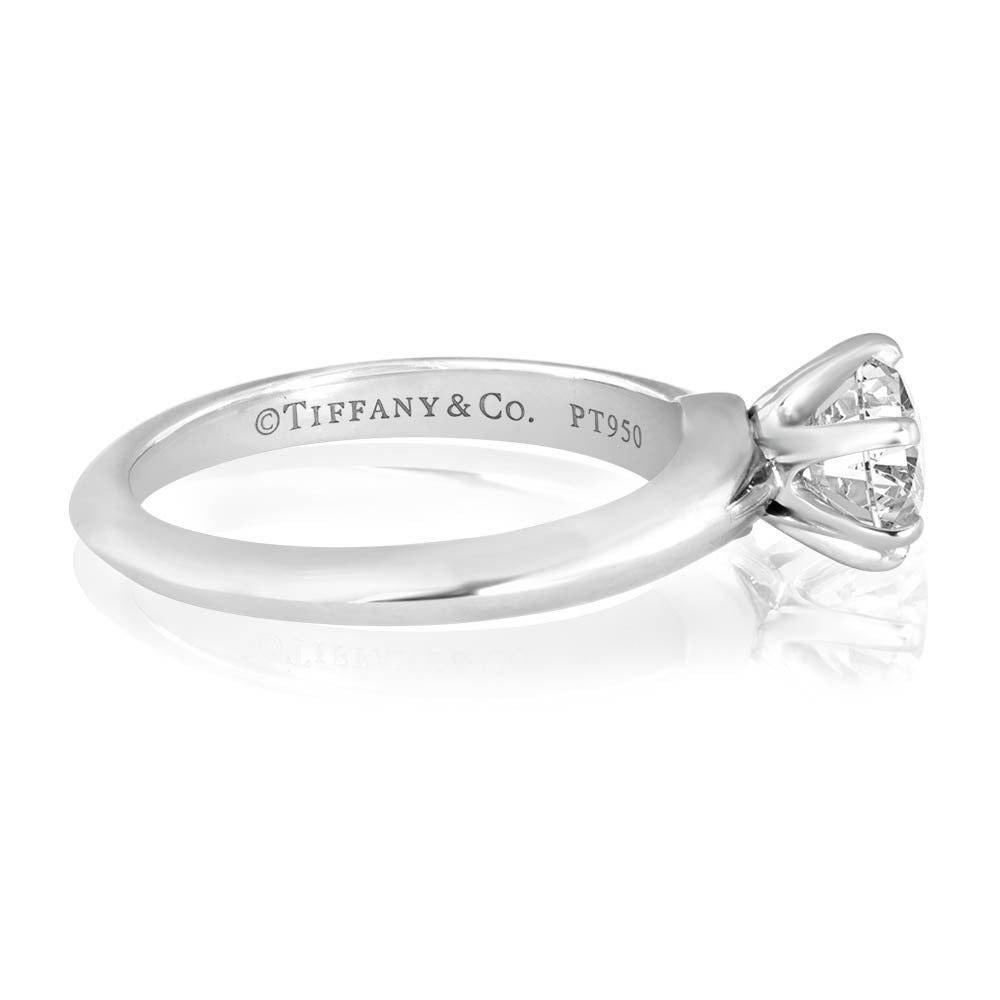 Pre-Owned Tiffany & Co. Engagement Solitaire Ring in PLT/950. The diamond is 0.90ct I VVS1 with T.&Co. N09182363 etched on the crown of the diamond. The ring is a size 5.25.