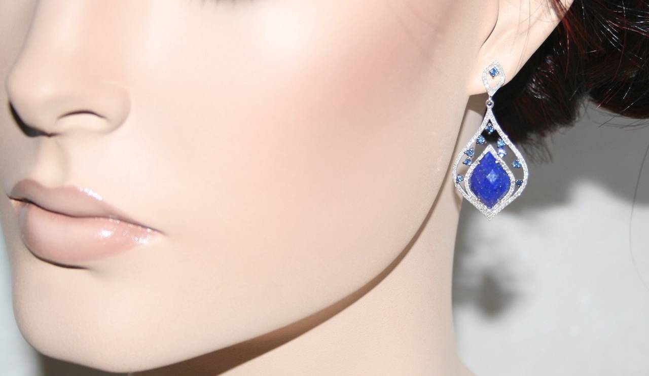 A pair of brand new beautiful drop earrings.
The earrings are lapis and blue sapphires with diamonds.
Set in 14K white gold weighing 7.6 grams.
9.90ct of Lapis
0.85ct of Diamonds
0.73ct of Sapphires
The earring measure 1.5