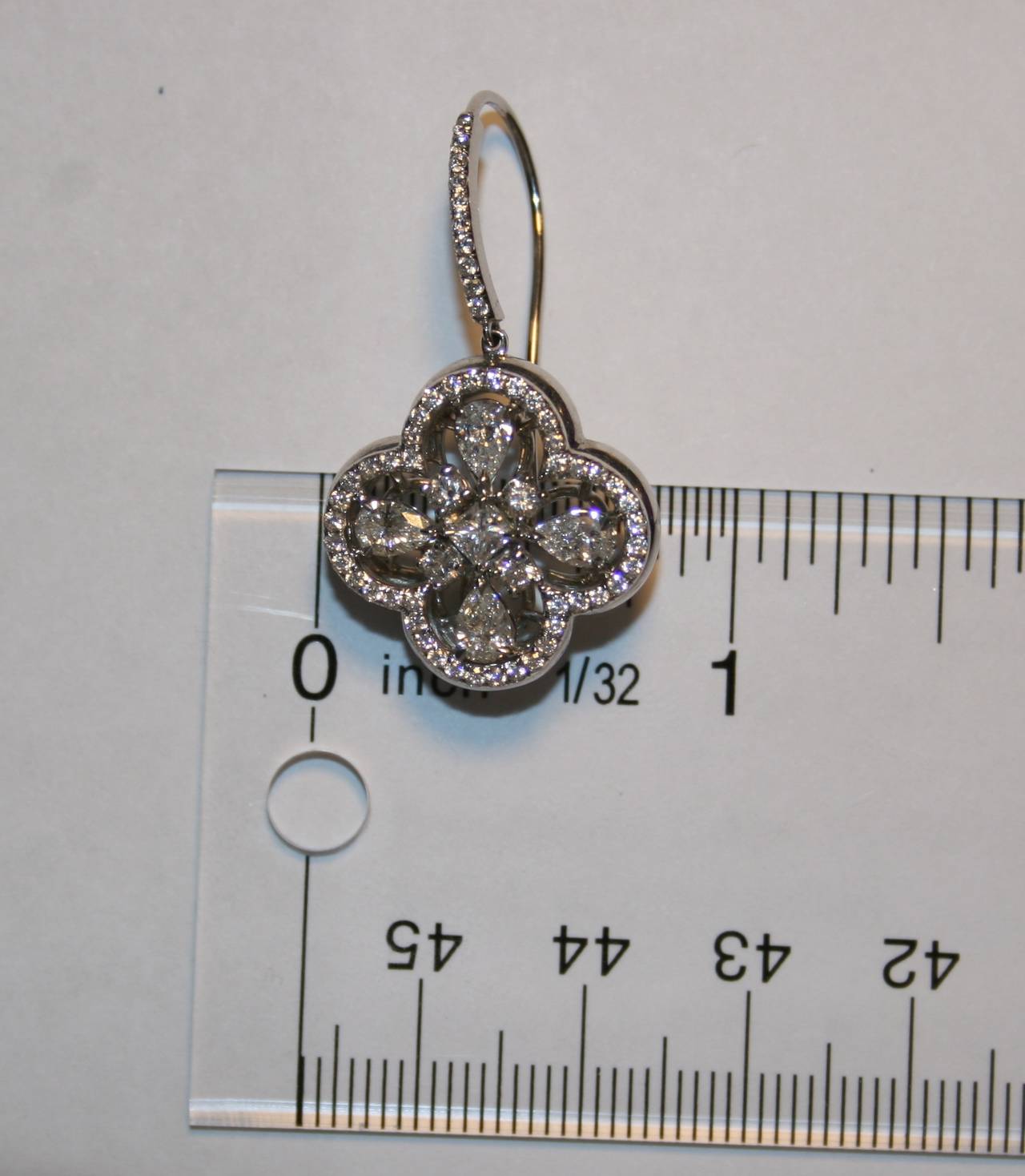 Pear Cut 3.15 Carat Diamond Clover Gold Earrings For Sale