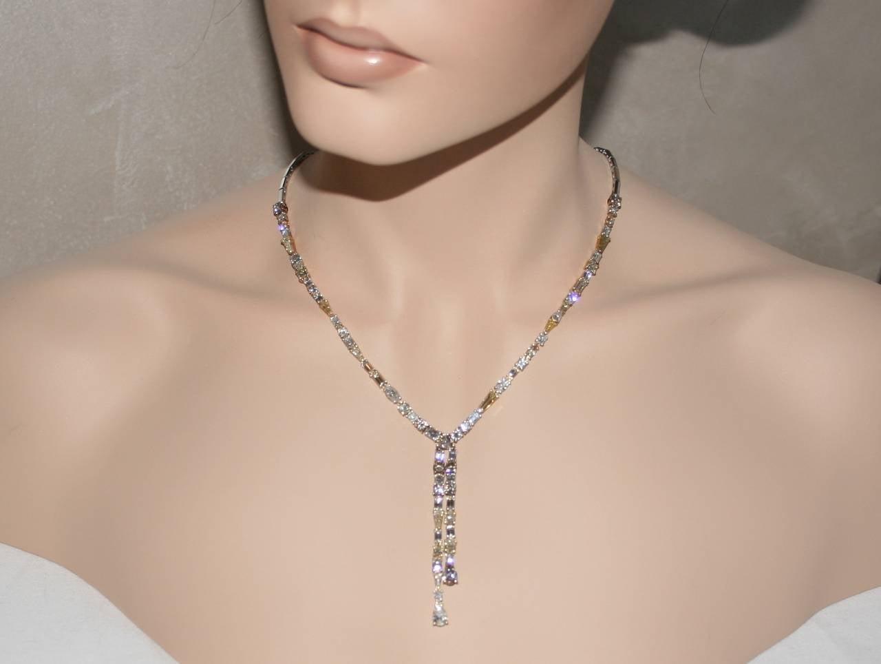 Fancy Colors & Shapes Diamond Necklace.
The necklace 14KWYR Gold.
There are 17.42 Carats in Diamonds VS/SI.
The diamonds are fancy colors and fancy shapes.
The necklace has white, yellow, brown, green, and many other fancy colors.
The white diamonds