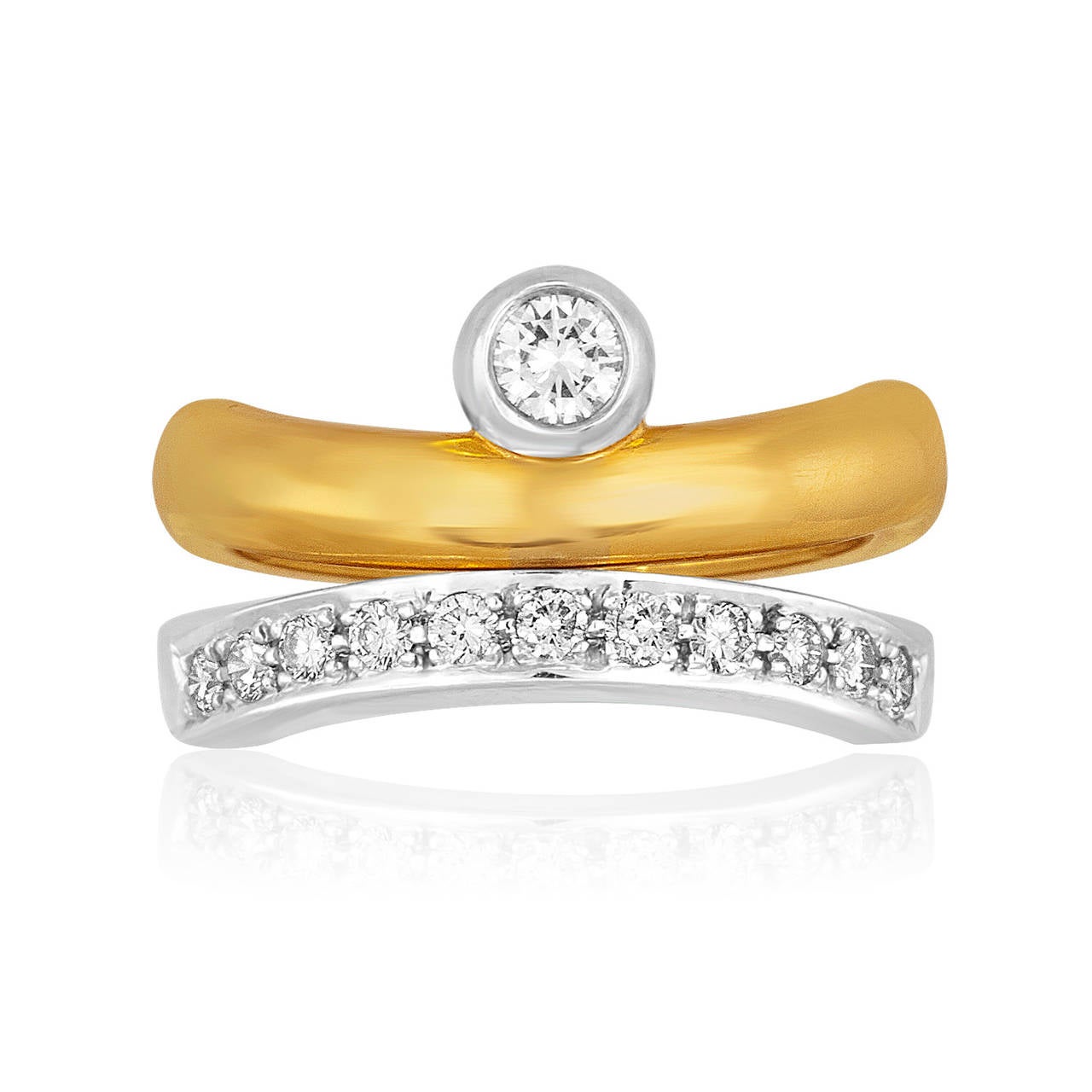 Very Unique Ring by BARAKA.
The ring flips open and can be worn in two ways.
The ring is two-tone 18K/750 white and yellow gold.
The center diamond is 0.50ct  FV
The small diamonds are 0.25ct F VS.
The ring weighs 13.8 grams
The ring is a size