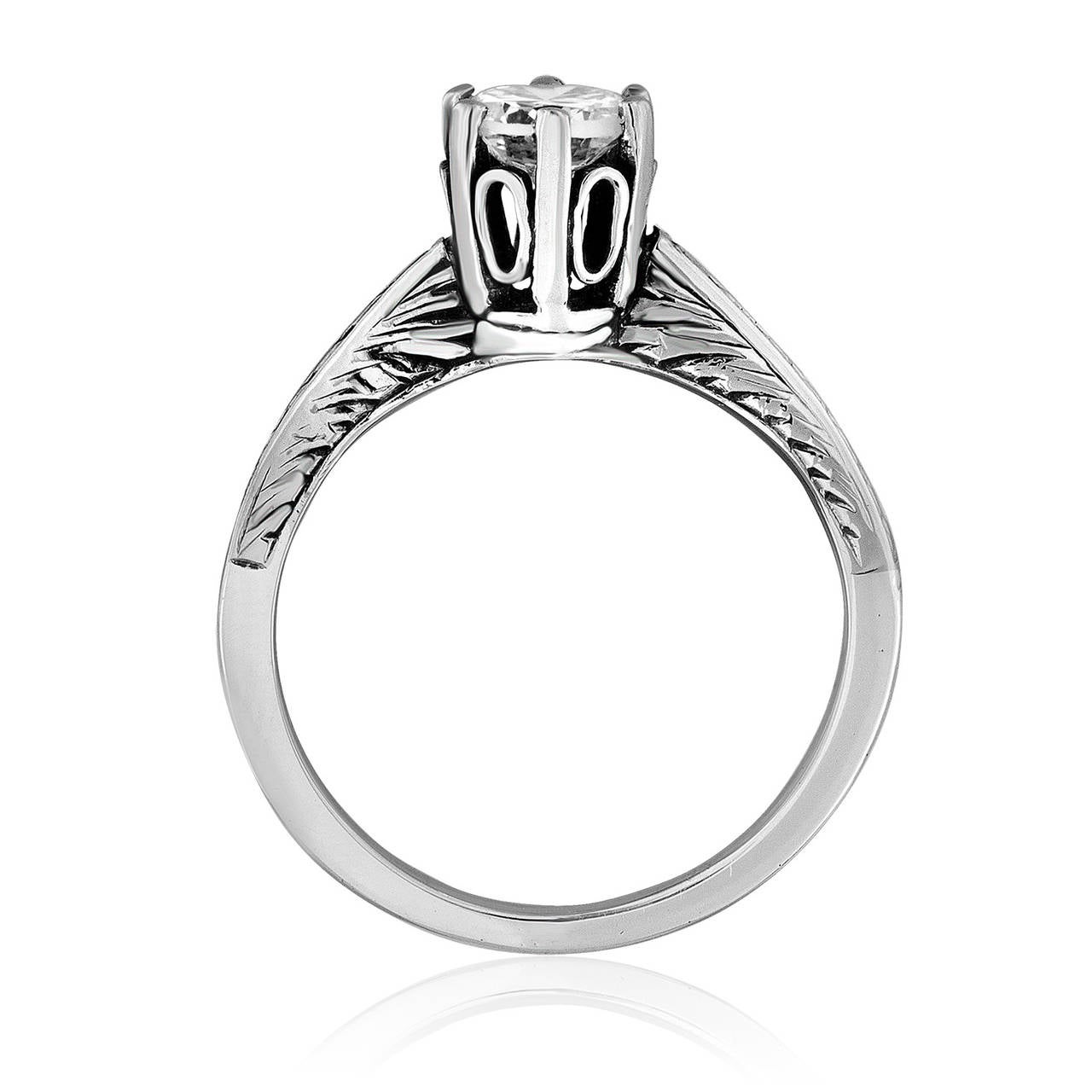 Bague très délicate.
L'anneau est en or blanc 14K.
La pierre est un 0.50ct  Diamant brillant rond F/G VS.
La bague est une taille 4.5.
Elle pèse 2.3 grammes.