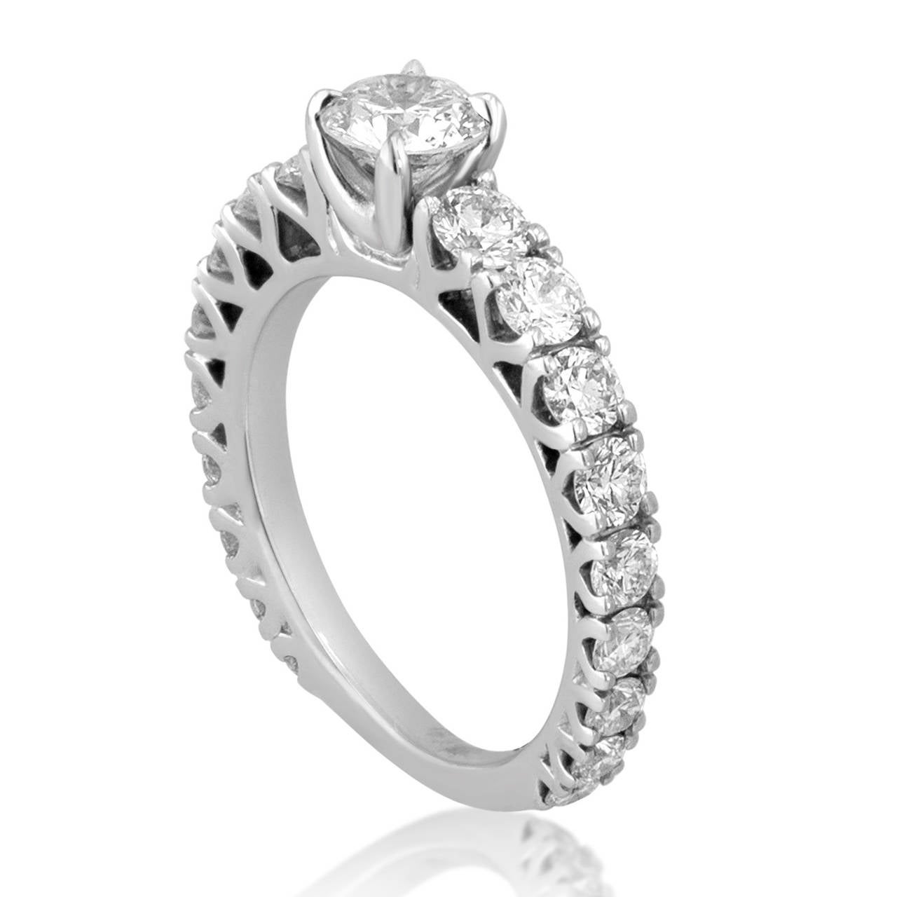 Jacob & Co. Diamond Engagement Ring.
The center stone 0.45ct F SI.
There are 1.00ct side stones G VS.
The ring is 18K White Gold.
The ring is a size 4, not sizable.
The ring weighs 3.3 grams