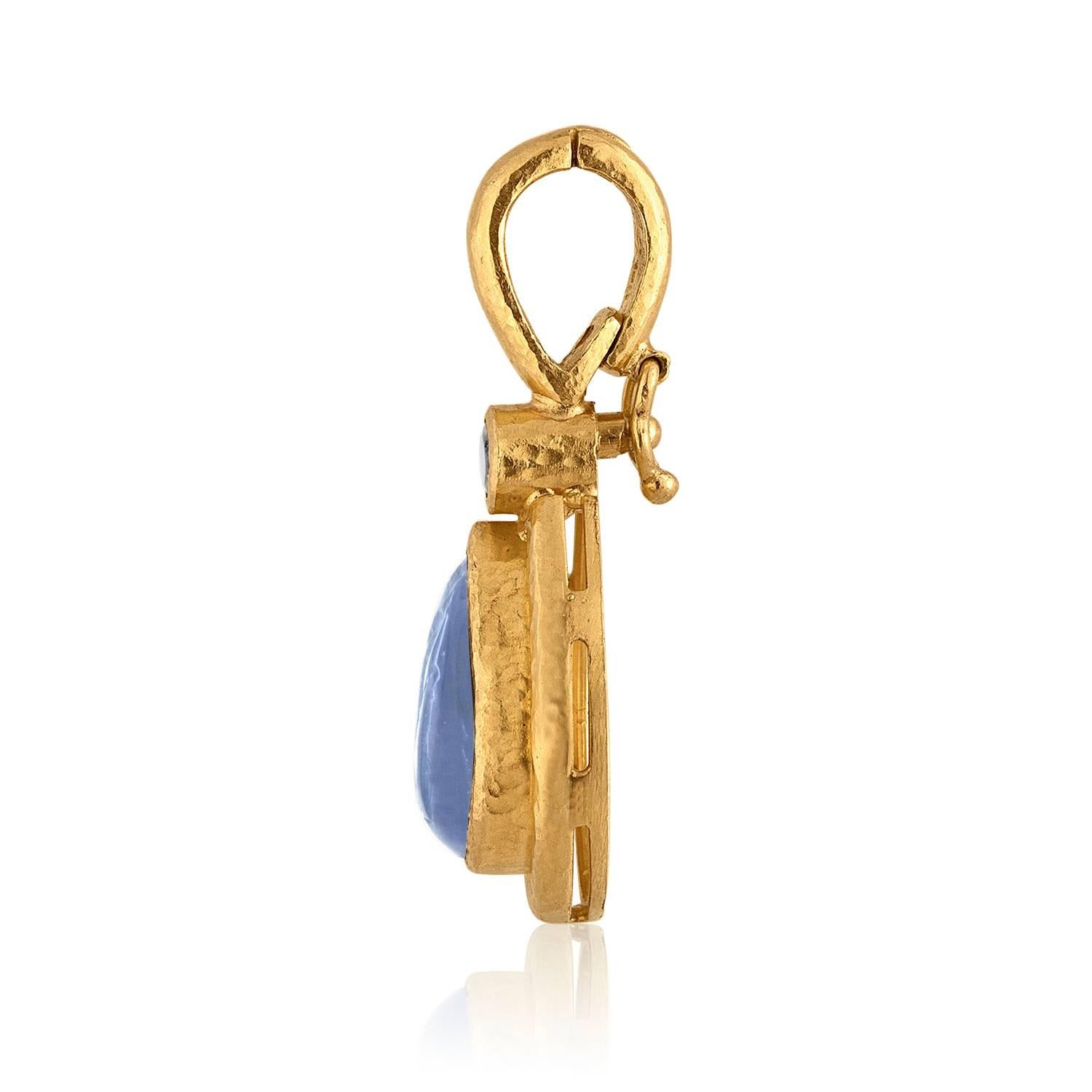 Elizabeth Locke Blue Intaglio Venetian Teardrop Pendant Set in 19K Hammered Gold with a small moonstone.
The pendant measures 1.5