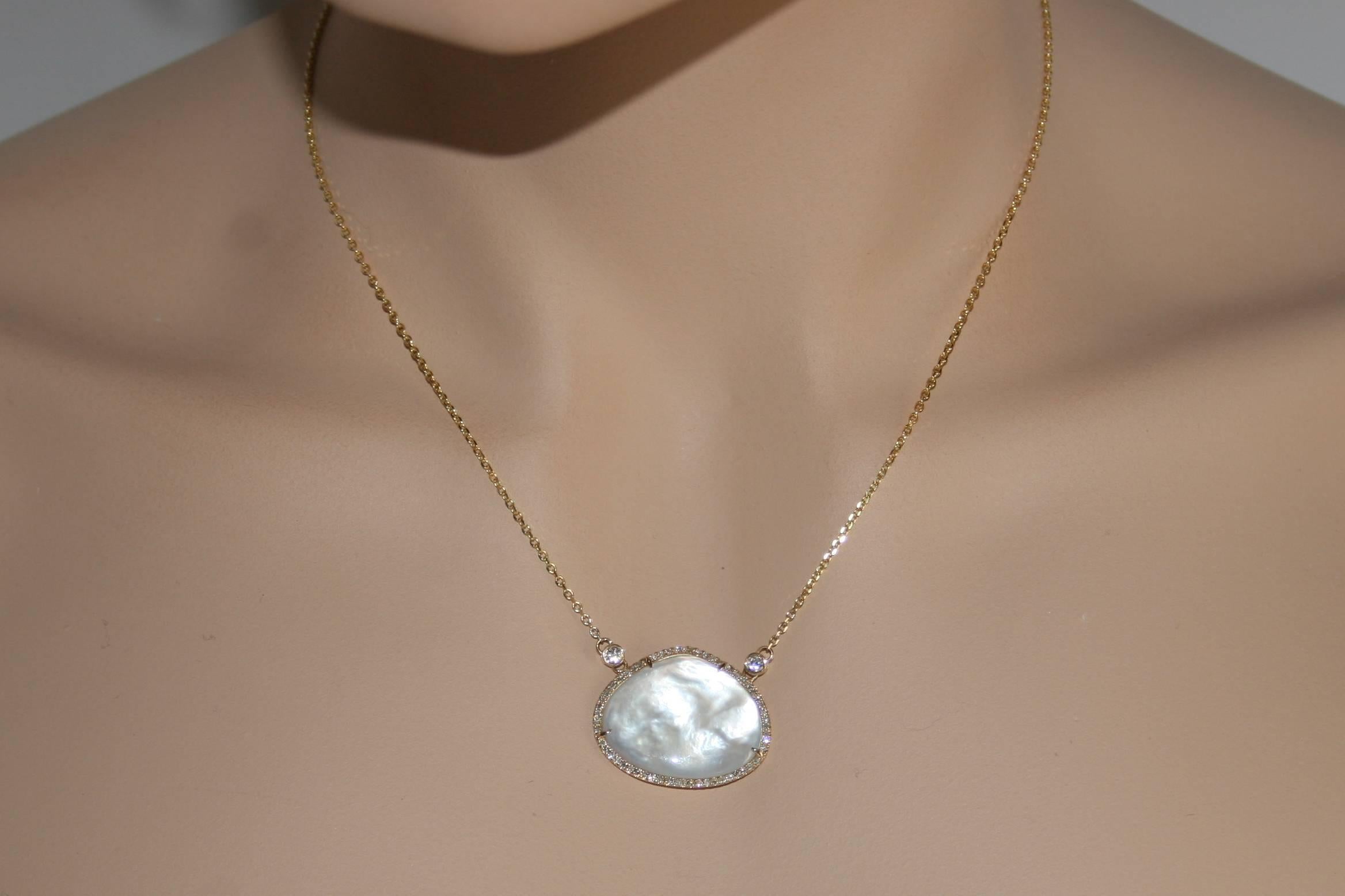 Stunning Mother of Pearl Necklace.
The necklace is 14K Yellow Gold.
There are 0.26ct In Diamonds.
The center is Mother of Pearl.
The necklace is 1