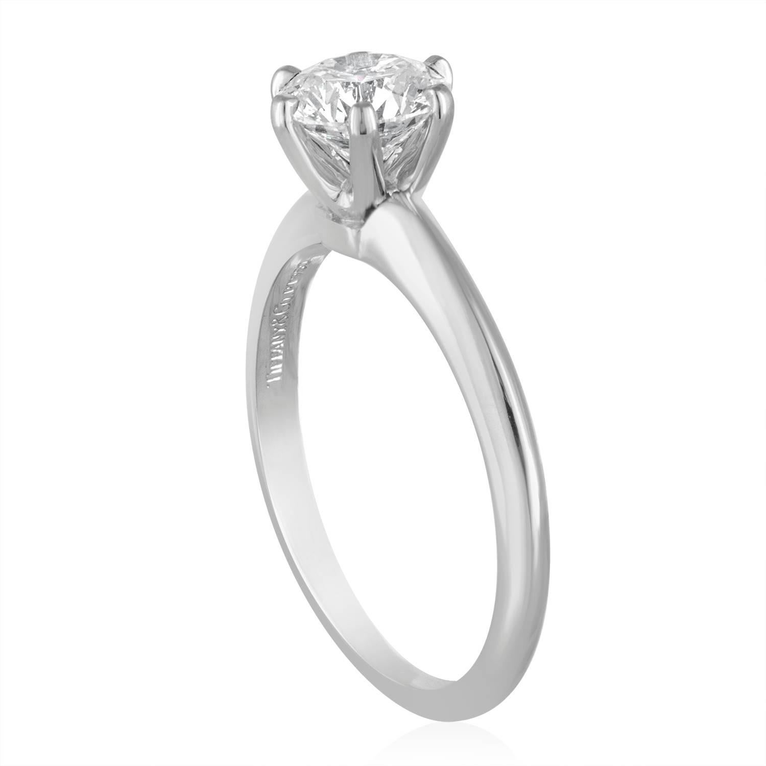 Tiffany & Co. Solitaire Engagement Ring.
The stone is GIA certified 1.19Ct F VS1 XXX.
Tiffany & Co. serial Number etched on the crown.
The stone is set in PLT/950.
The ring comes with a GIA certificate.
The ring is a size 7.5, sizable.
The ring
