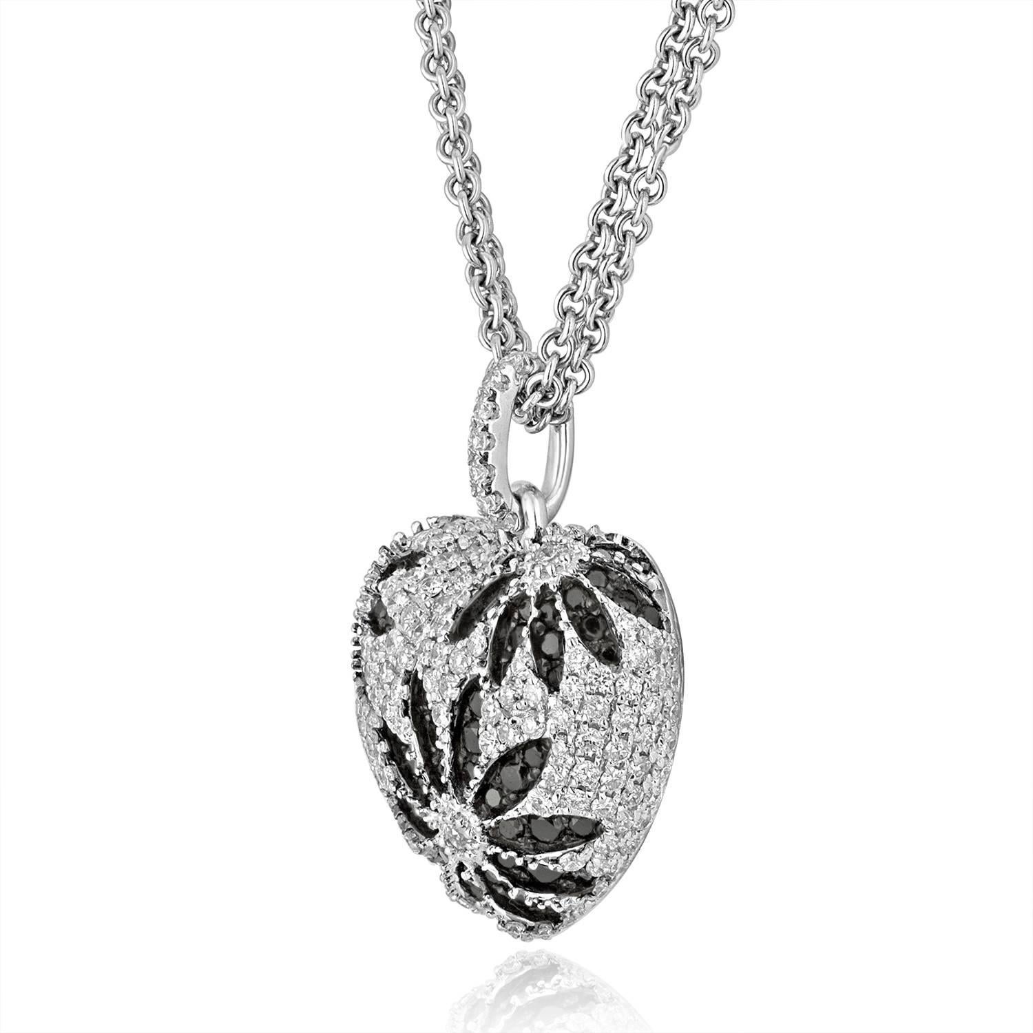 Beautiful Puffy White Diamond Heart accented with Black Diamonds to make Flower Design.
The pendant is 18K White Gold.
There are 1.84Ct of black and white Diamonds G/H SI.
The Heart measures approximately 1