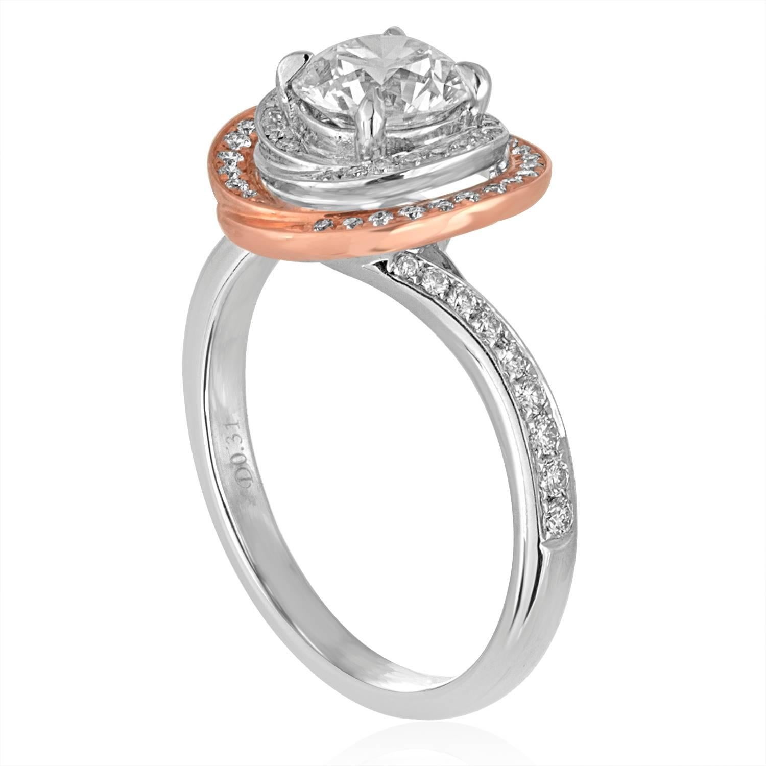 The ring is 18K White & Rose Gold Halo Engagement Ring
The center stone is GIA Certified 1.05 Ct F VS2
The Halo & Band has 0.31 Ct in Diamonds E/F VS
Size 6.5, sizable
The ring weighs 4.5 grams
