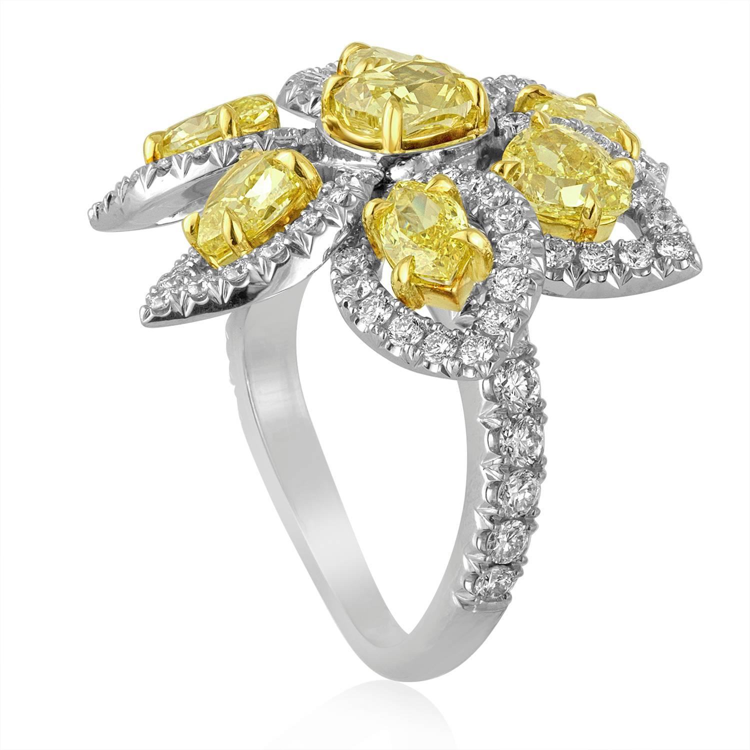 Very Beautiful & Exotic Flower Ring.
The ring is PLT 950/18K White & Yellow Gold
There are 3.46 Carats in Natural Fancy Yellow Diamonds VS Clarity
There are 1.78 Carats in White Diamonds F VS
The ring is a size 7, not sizable.
The flower top is