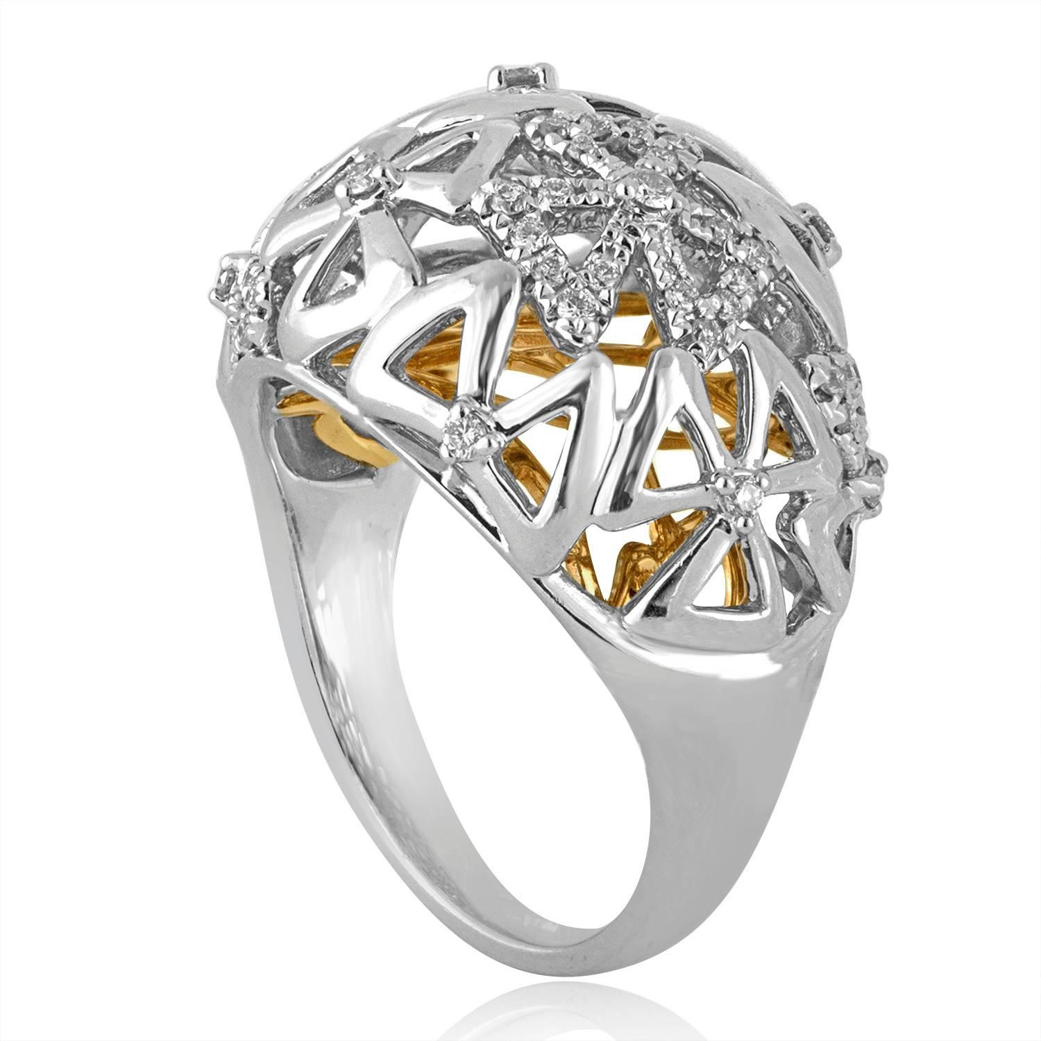 Very Beautiful Modern Abstract Dome Cocktail Ring
The ring is 18K White & Yellow Gold
The ring has 0.35 Carat in Diamonds G/H VS/SI
The ring is a size 6.75, sizable.
The ring weighs 8.9 grams.