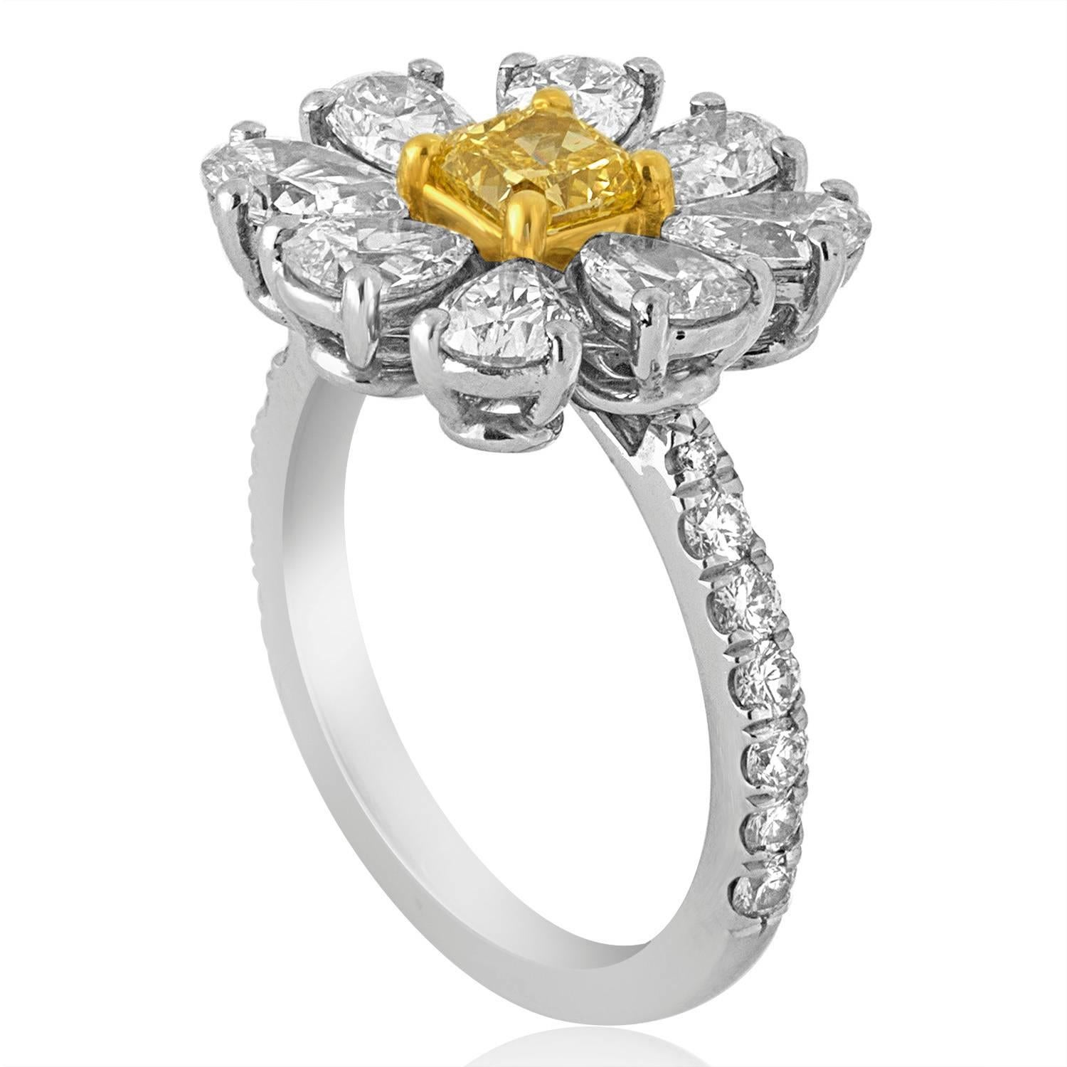 Daisy Flower Ring
The Ring is Platinum 950 & 18K Yellow Gold.
The center stone is FANCY YELLOW VS Quality 0.54 Carats.
There are 2.04 Carats Total in Pear Shapes F VS.
There are 0.35 Carats Total in Small Round Diamonds F VS.
The ring measures