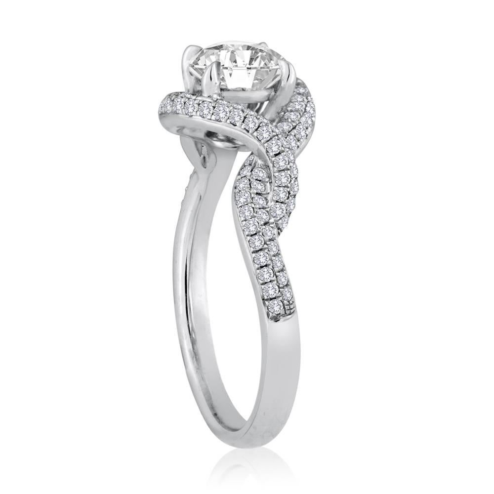 Very Unusual Twisted Halo Infinity Ring
The ring is 18K White Gold
The center Stone is 0.51 Carat Diamond F VS
The setting has 0.44 Carats In Diamonds F/G VS/SI
The ring is a size 6.5, sizable
The ring weighs 4.0 grams