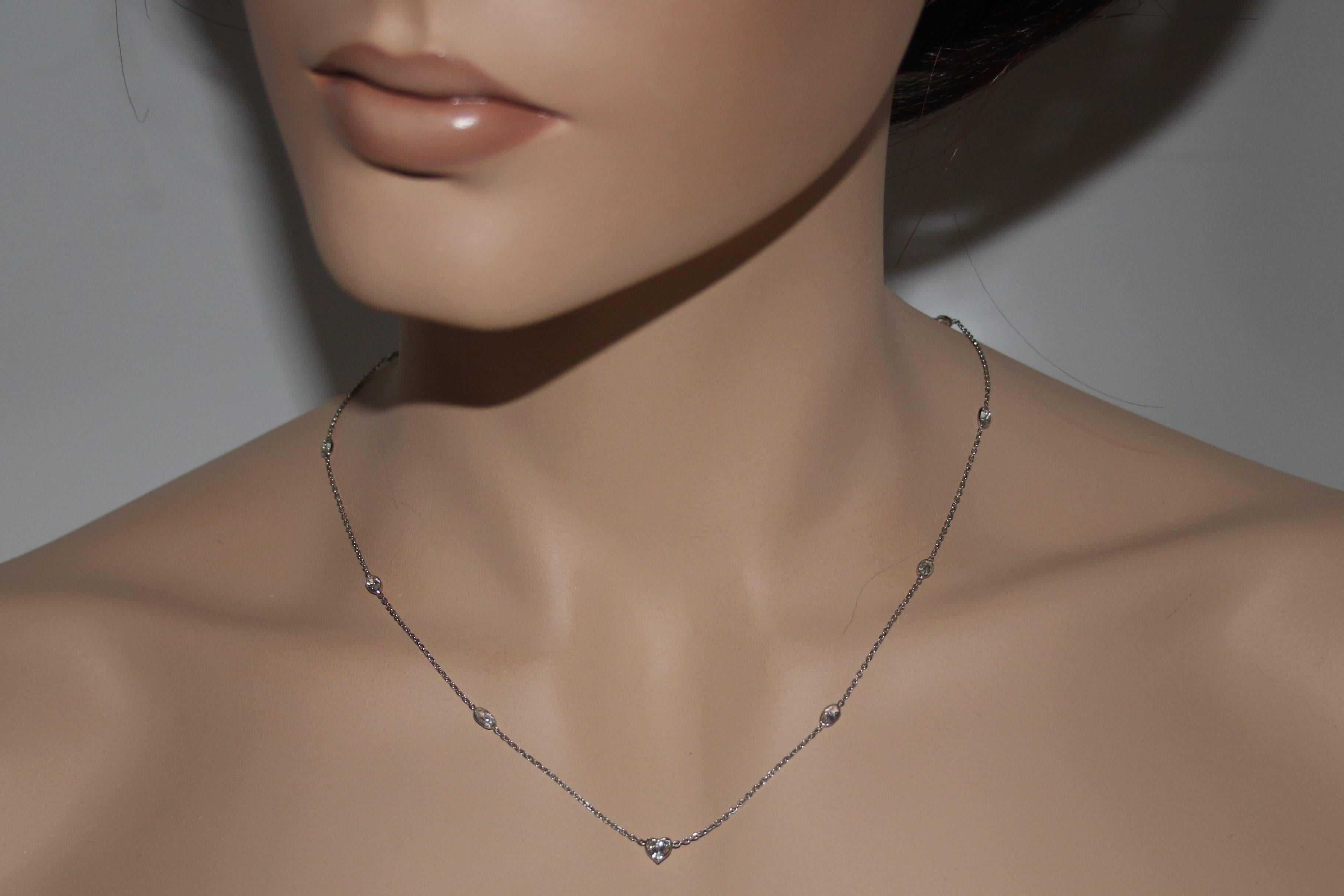 Very Unusual Diamond Necklace
The necklace is 14K White Gold
The stones are oval shaped with a Heart Shaped Center
The center stone is Heart Shape 0.37 Carats H SI
The other stones are oval shaped 1.48 Carats H SI
The necklace is 18