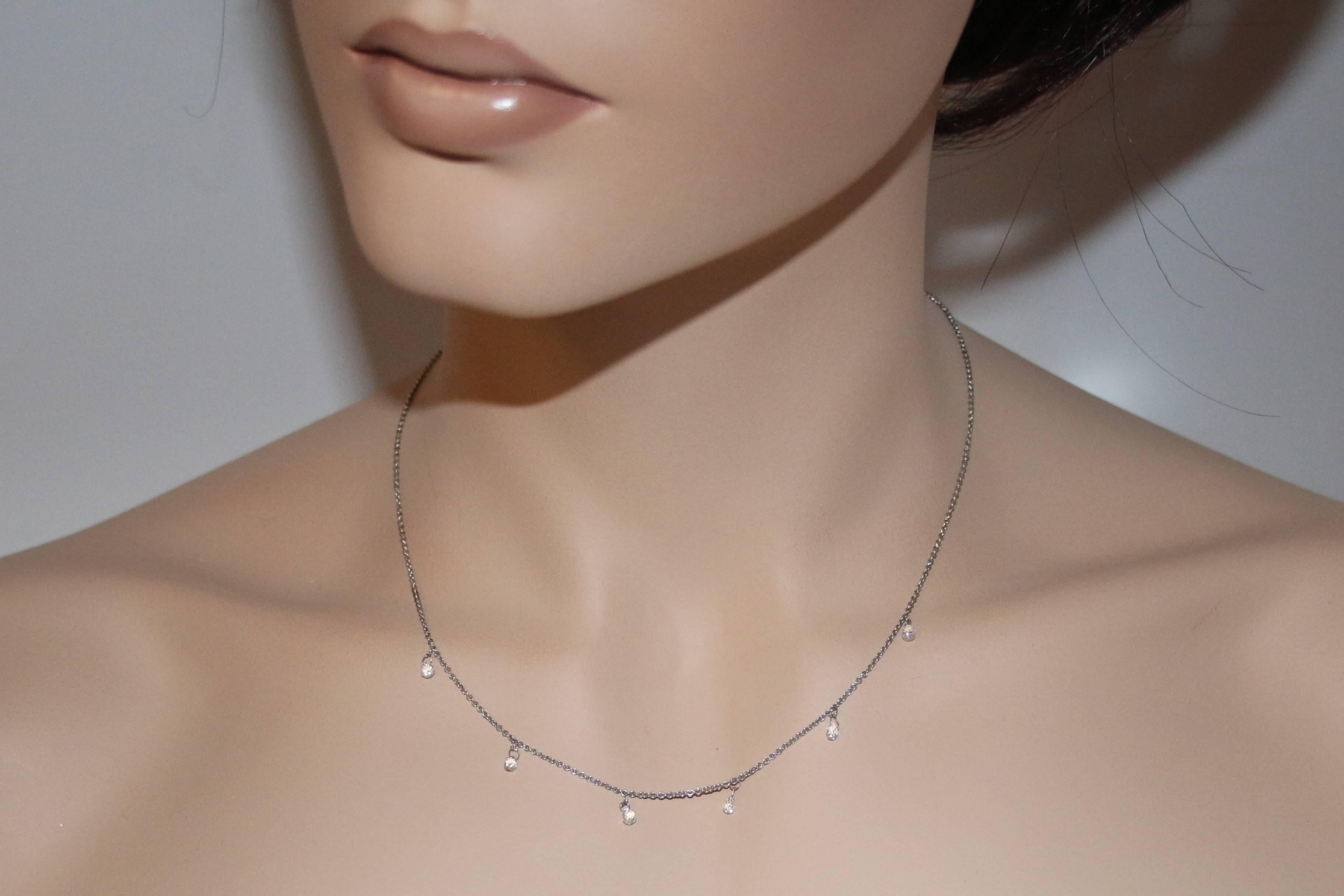 The necklace is 14K White Gold
There are 1.20 Carats in Diamonds G/H VS
The necklace is 16
