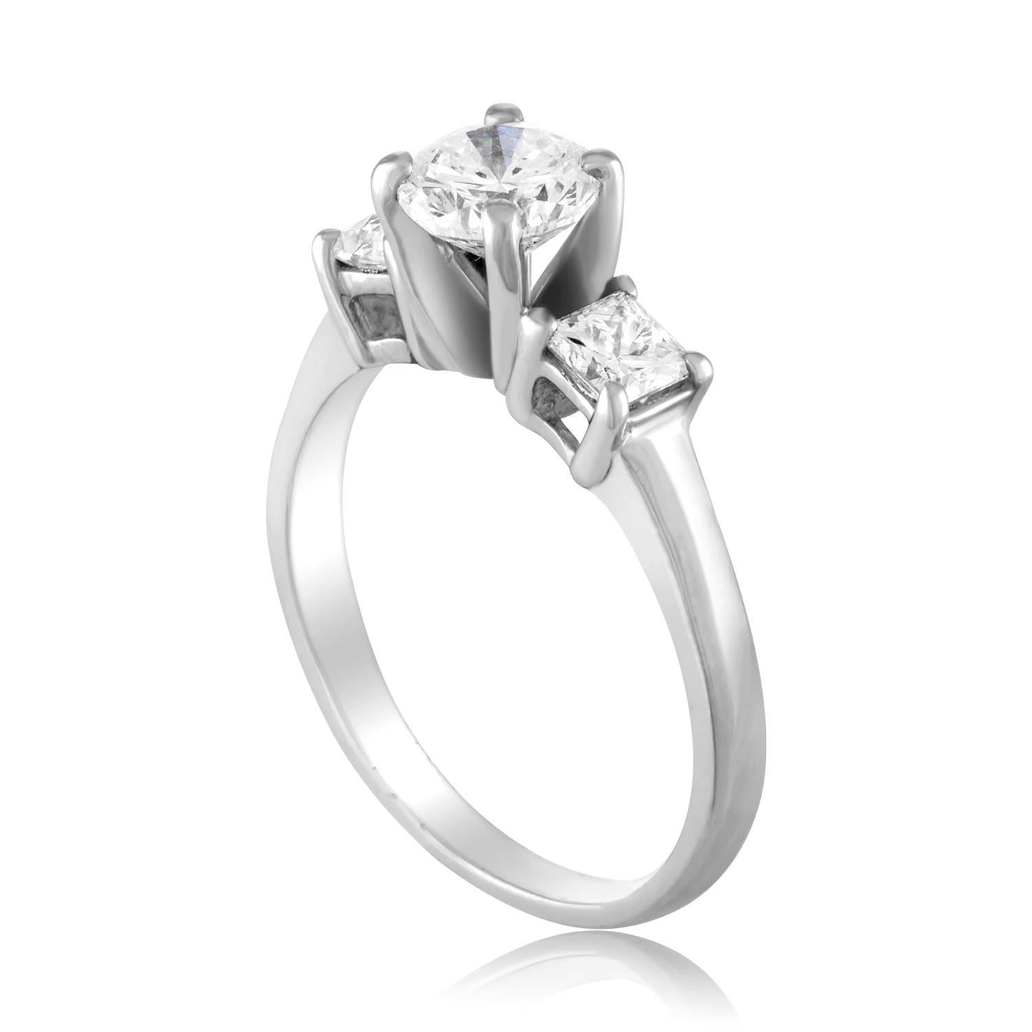 The ring is Platinum 950
The center stone is a Round Brilliant Diamond
The Center stone is GIA Certified 0.90 Carats H VS2
The 2 Side stones Princess Cut Diamonds 0.50 Carats Total Weight G VS
All 3 diamonds total 1.40 Carats.
The ring weighs 5.8