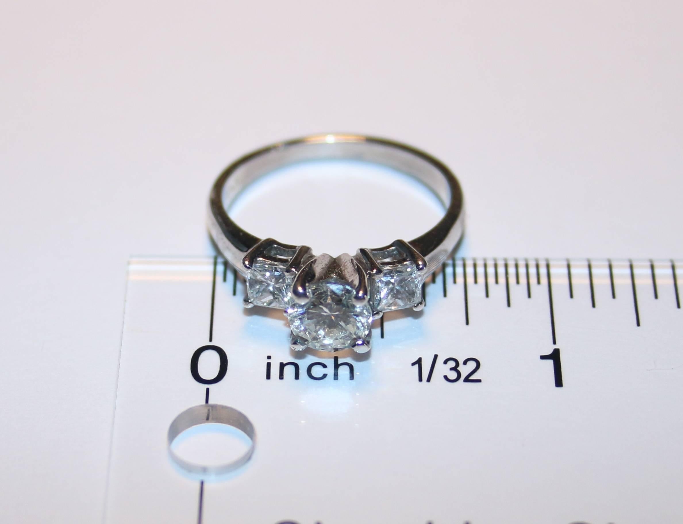 Round Cut GIA Certified 0.90 Carat H VS2 Diamond Three Stone Platinum Ring For Sale