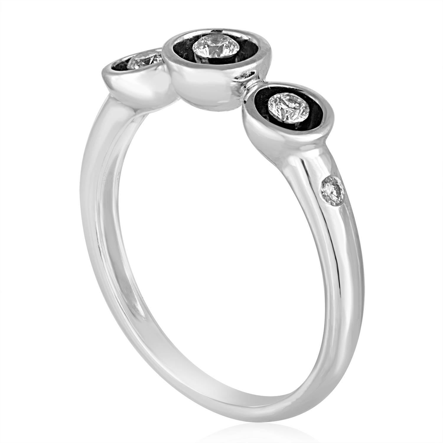 Fun Stackable Ring
The ring is 14K White Gold
There are 0.18 Carats In Diamonds G/H SI
The black enamel is inside the 3 circles
The ring is a size 6.5, sizable
The ring weighs 2.6 grams
